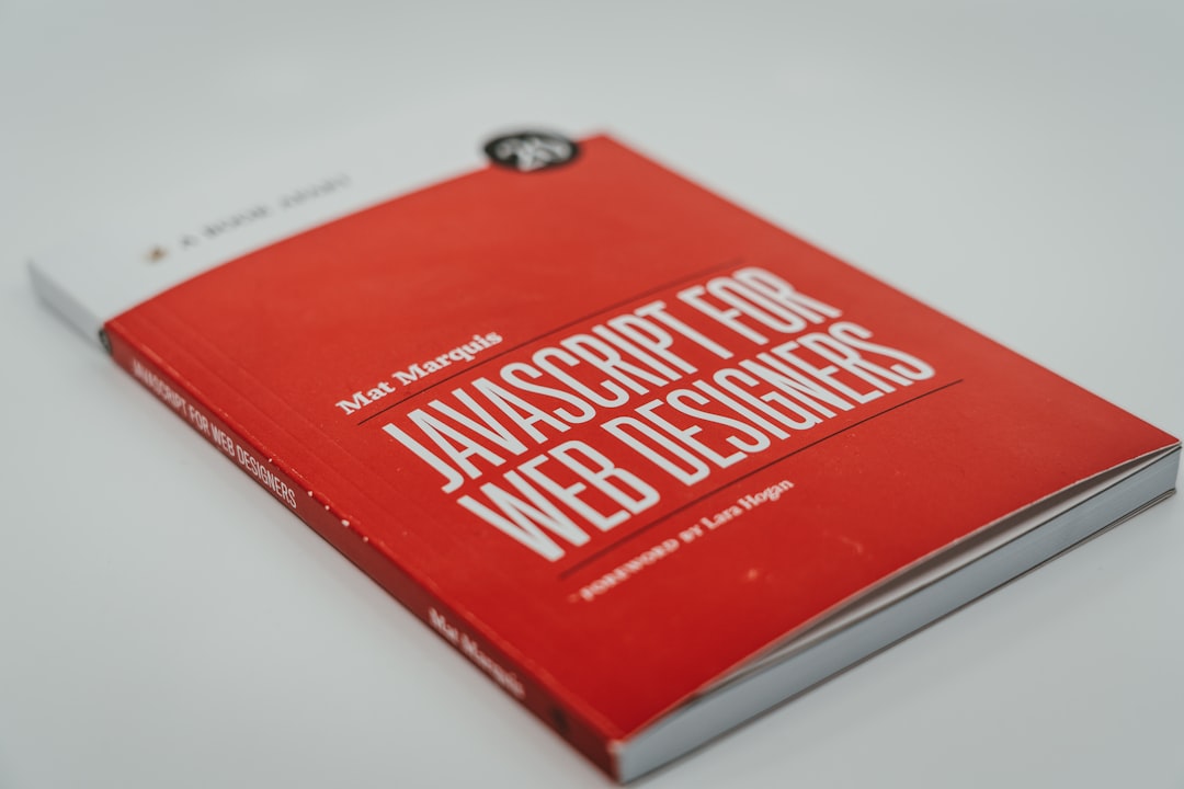 a-red-book-sitting-on-top-of-a-white-table-i25aqe-yuzs